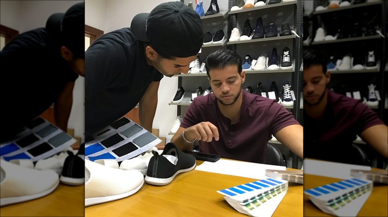 Muvez co-founders looking at shoe samples