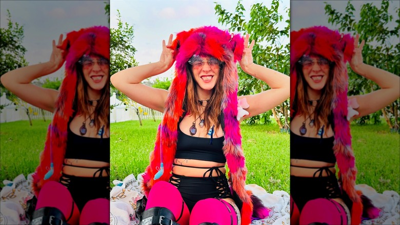 Woman wearing a SpiritHood hat