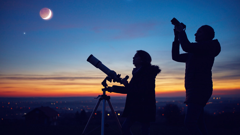 People stargazing, camera and telescope
