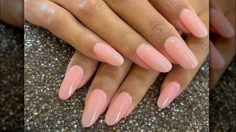 Gel manicure with light pink polish