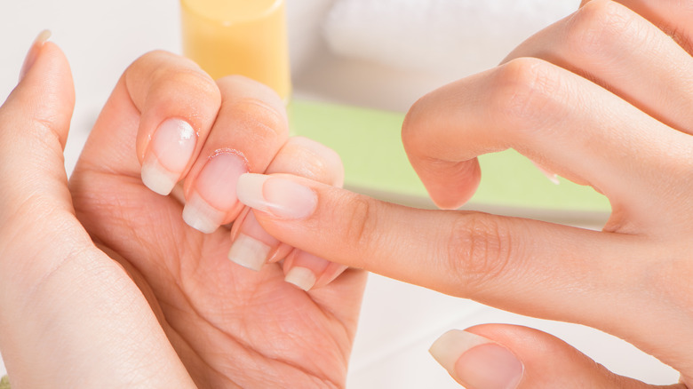 Person applying product to their nails