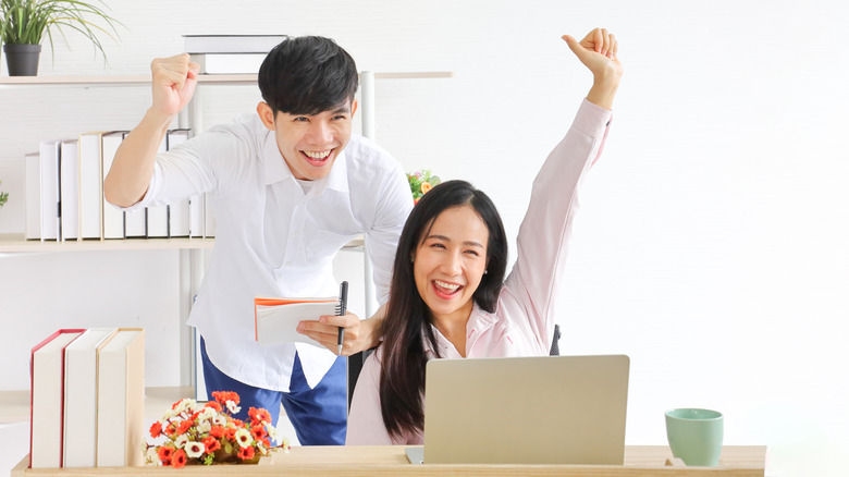 young couple happy about investment