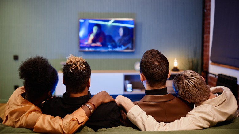 Four people watching tv