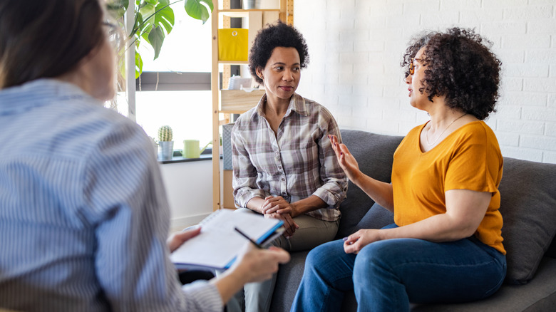 Two women on a couch in a therapy session