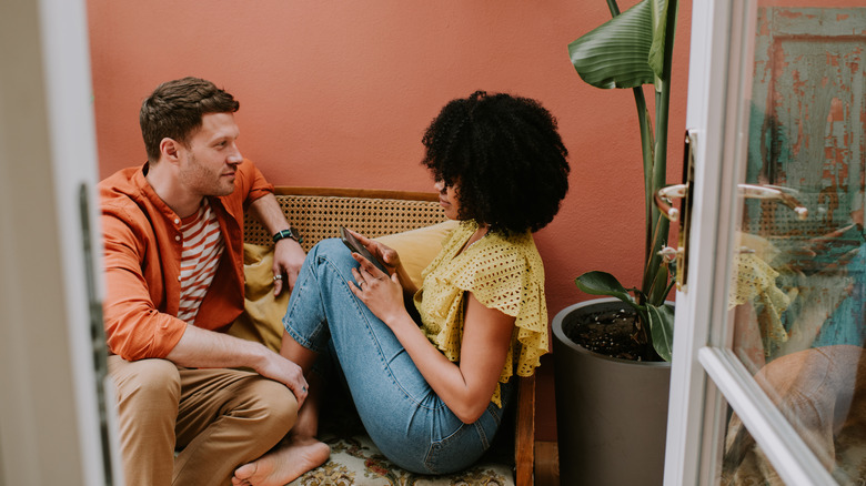 Couple having a conversation on a bench