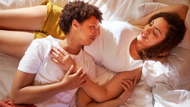 Couple talking in bed