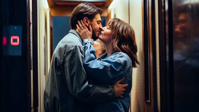 People kissing in an elevator