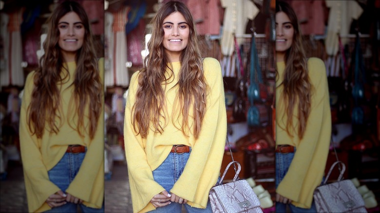Woman in yellow sweater