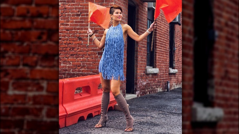 Woman in fringe dress with suede gladiator boots