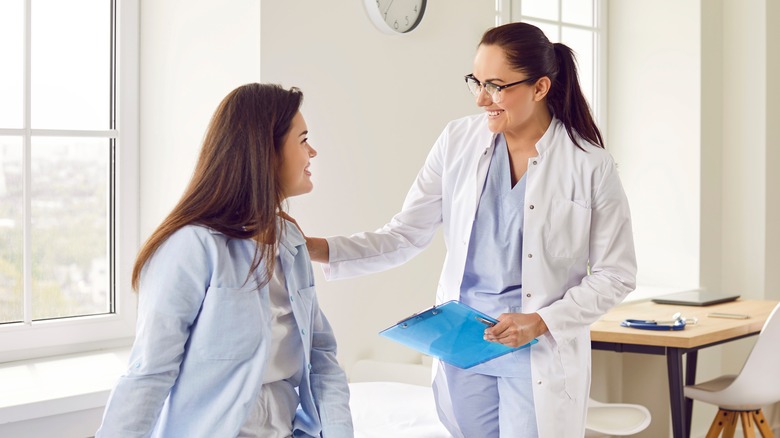 Woman speaking to a doctor