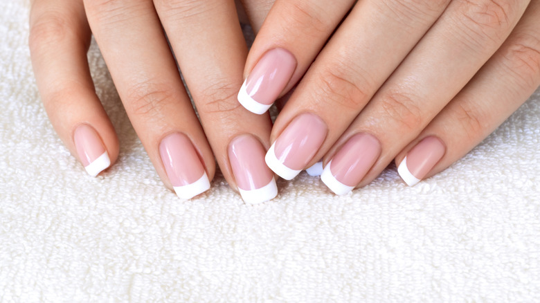 woman with french tips nails