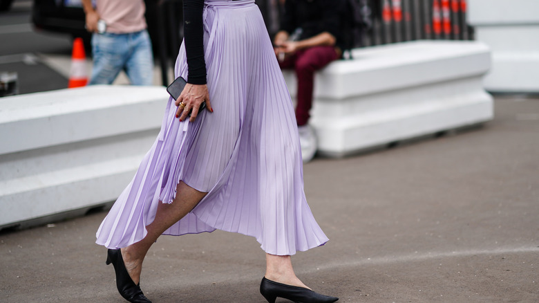 Woman wears digital lavender skirt
