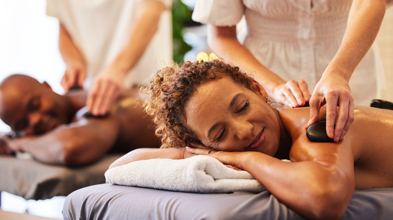 man and woman getting massages