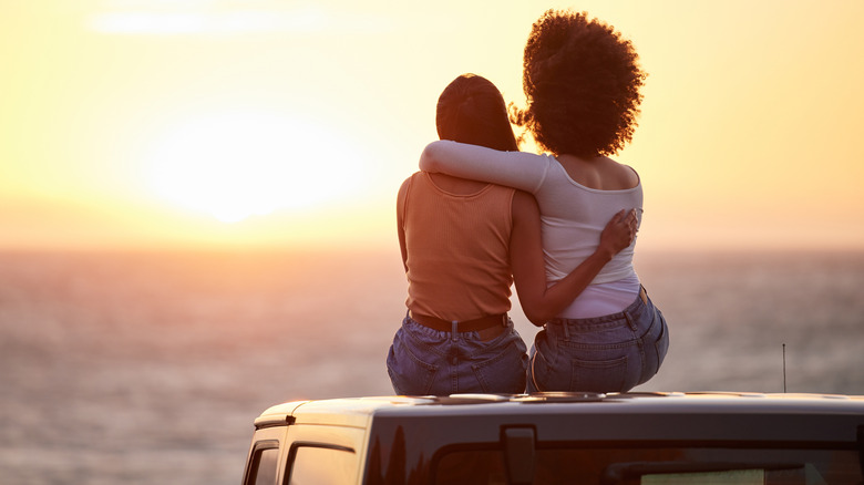 two women on car hood