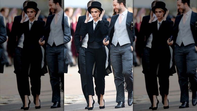 Cara Delevingne in a suit and top hat