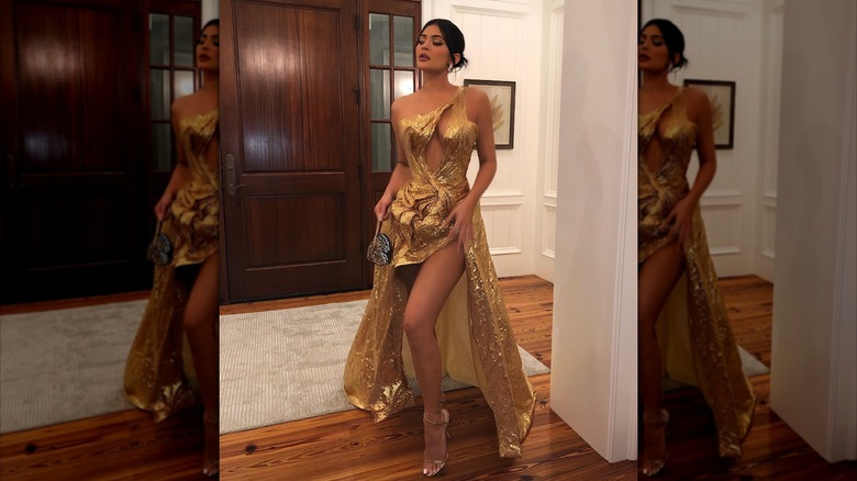 Kylie Jenner in a gold dress