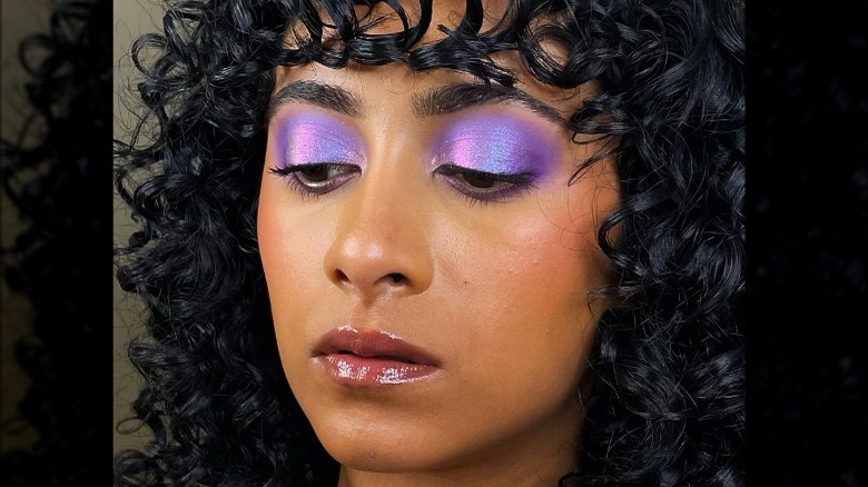 Woman wearing purple metallic shadow 