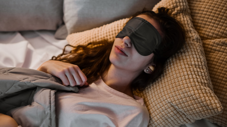 Woman with an eye mask on
