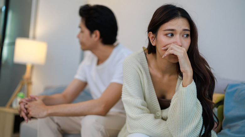 couple in an argument on couch