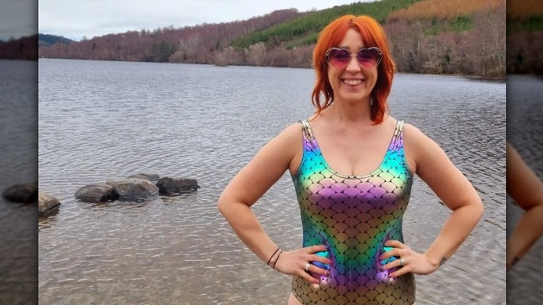 Woman in iridescent scaled swimsuit