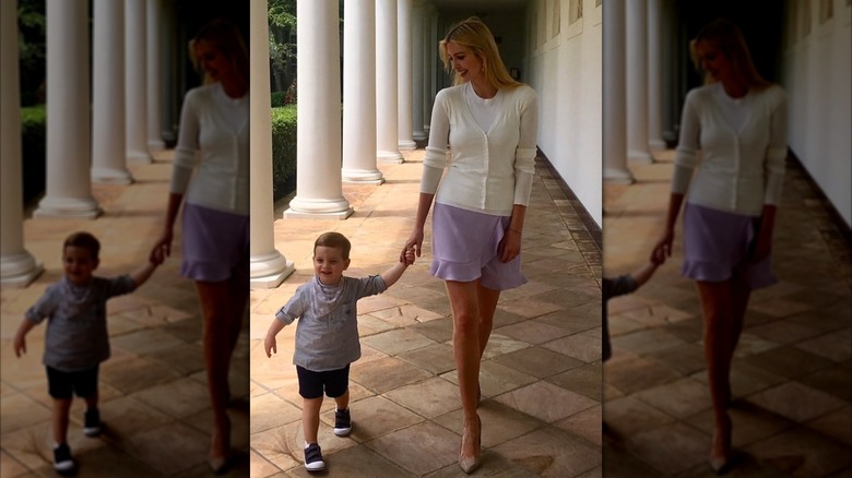 Ivanka Trump in a white cardigan and lilac skirt