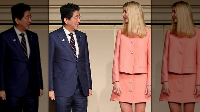 Ivanka Trump in a pink skirt suit next to the Prime Minister of Japan