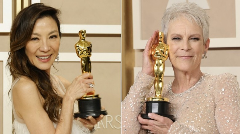 Michelle Yeoh and Jamie Lee Curtis with their Oscar statues