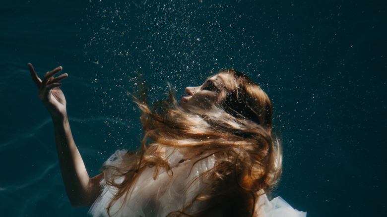 Woman submerged in water