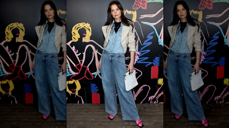 Katie Holmes in jeans and a denim shirt with pink socks