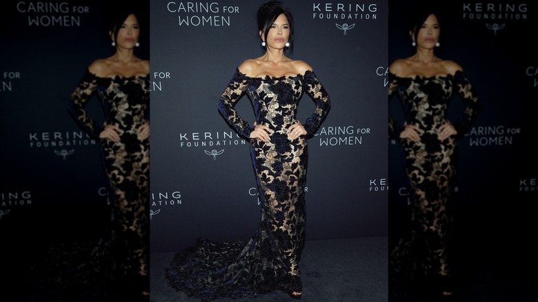 Lauren Sanchez in a sheer gown with navy blue flowers at an event