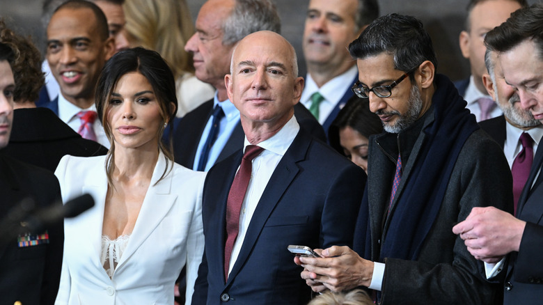 Lauren Sanchez in a white suit with Jeff Bezos at the Inauguration Ceremony in January 2025