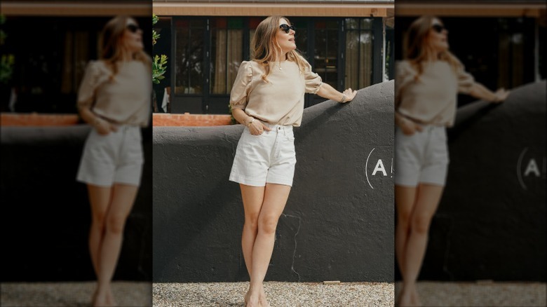 Woman in white denim shorts