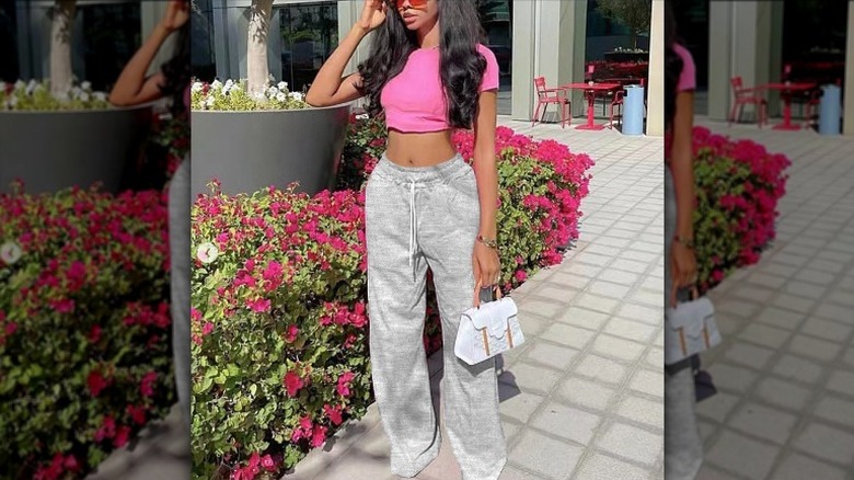 Woman wearing sweats and crop top