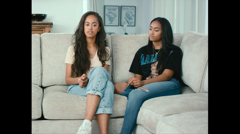 Malia and Obama sitting on a couch during a documentary interview