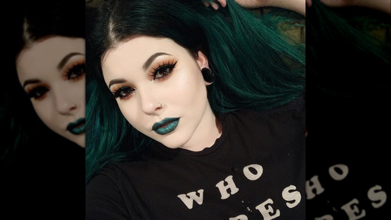 Woman wearing green lipstick