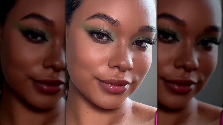 Woman wearing green makeup