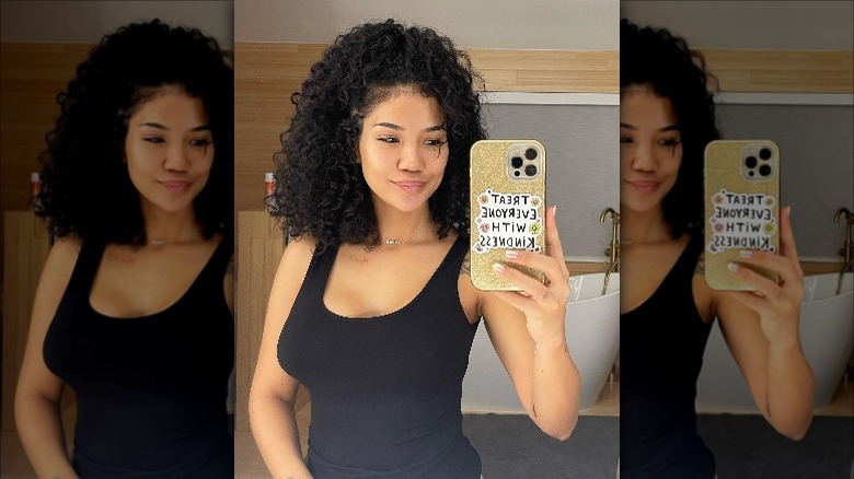 brunette curly hair mirror selfie