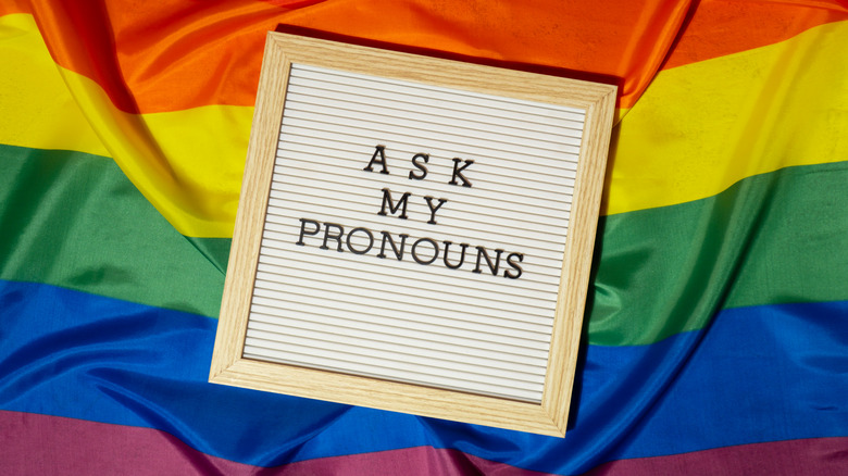 ask my pronouns picture with LGBTQ+ flag