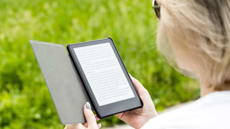 Woman reading a kindle