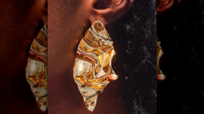 woman in molten gold earring