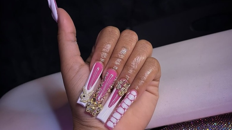 Long nails with a pink base and white tips