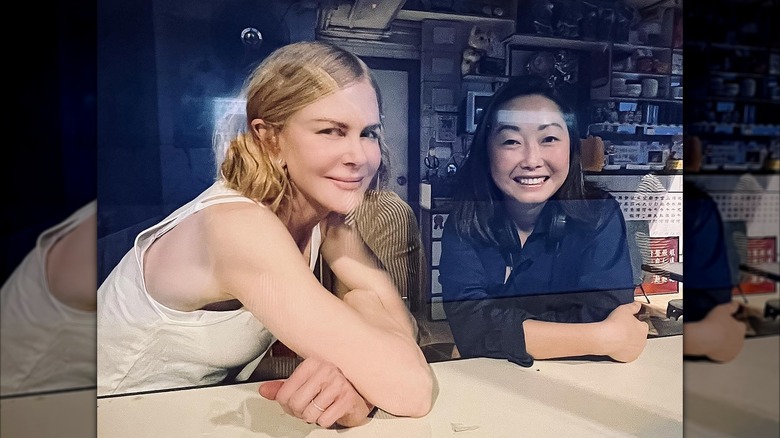 Nicole Kidman smiling next to Lulu Wang