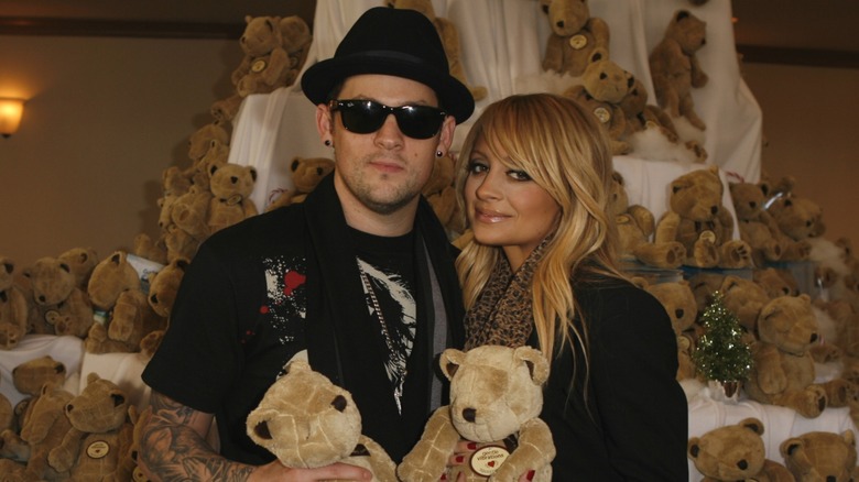 Joel Madden and Nicole Richie holding teddy bears