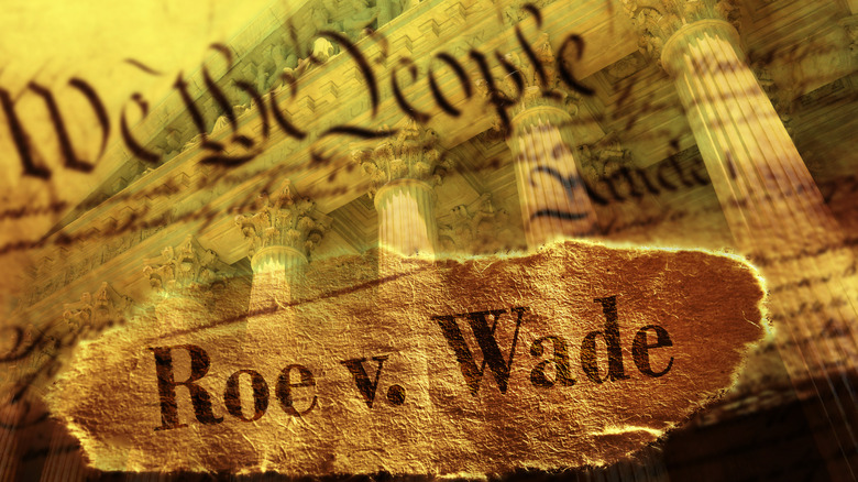 Paper that reads "We the People" and "Roe v. Wade"
