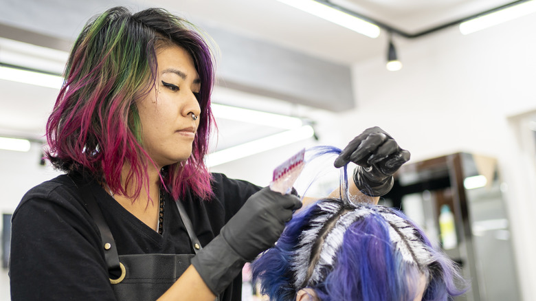 Woman applying hair dye