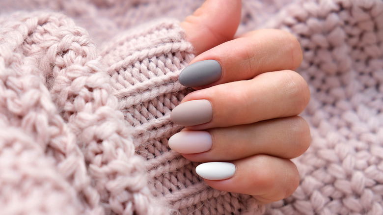 Long nails touching sweater
