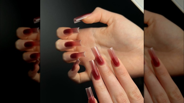 Translucent red nails
