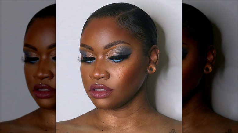 Woman with shimmery glitter eyeshadow and glossy lip