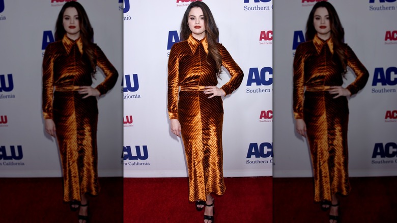 Selena Gomez in an orange, velvet dress on the red carpet