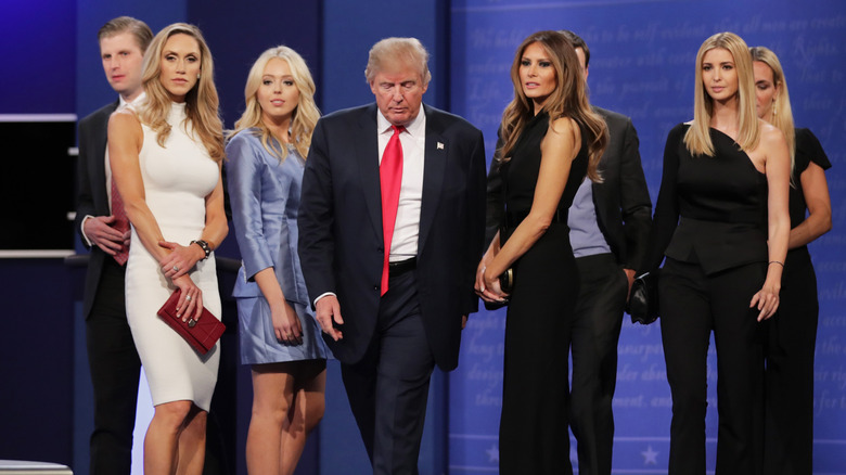 (L-R) Lara, Tiffany, Donald, Melania, and Ivanka Trump on stage at an event